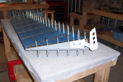 Bottom of right ele. inboard side