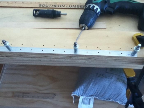 clamped, and drilled into scrap plywood strip