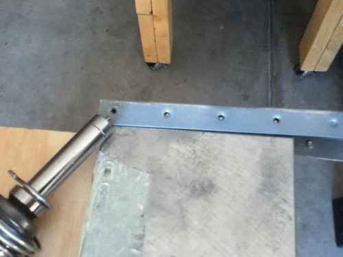 Back rivet plate with countersunk hole to reach narrow dimple holes