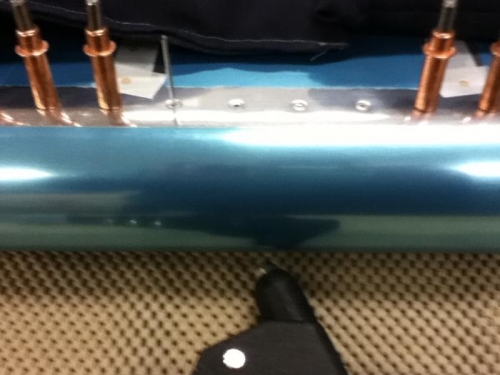 Installed pop rivets from center out