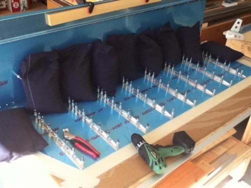 Clamed, clecoed, taped and then drilled.