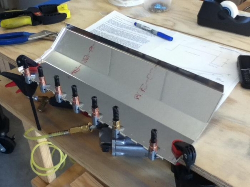 Hinge clamped to lid ready to drill