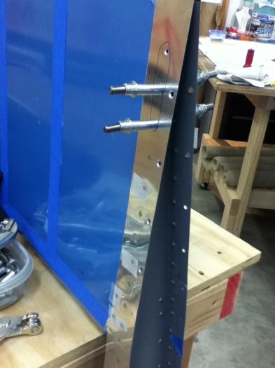 Riveted, last three holes left open to get to trailing edge