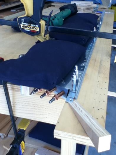 Clamped and sand bagged for drilling