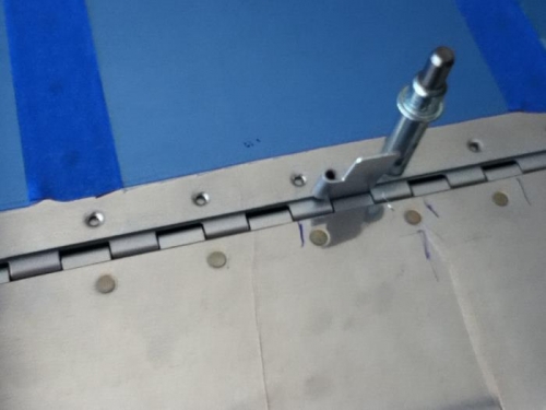 Spare hinge material to measure gap