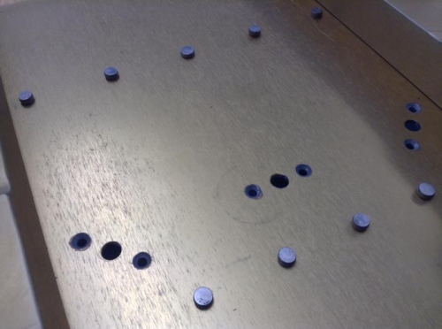 Qtip and primer sprayed in cap dabbed in hole