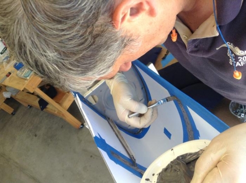 brushing on sealant to set rib