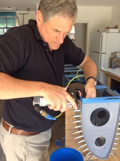 CAREFULLY squeezing first rivet