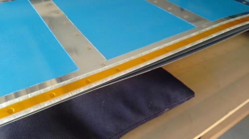 Rivets taped in place