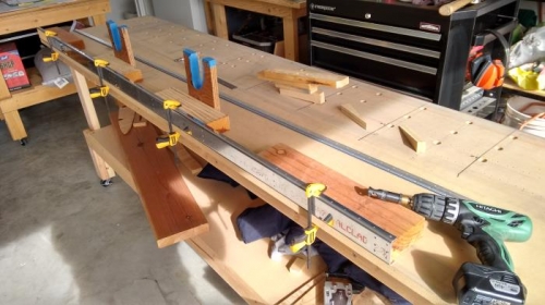 Clamped 2x4 to table with spar flange between them