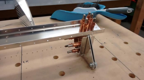 Hinge brackets clecoed to spar