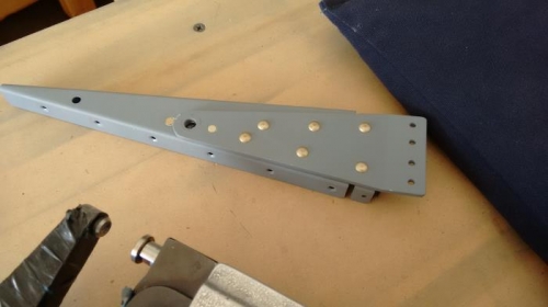 906B riveted to end rib.