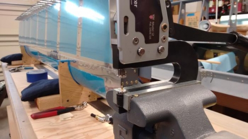 Pre squeezing rivets for tighter fit