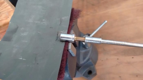 Sandpaper/Scotch brite held by vise