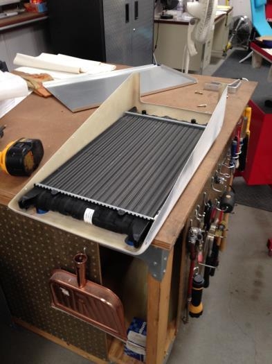 Fitting radiator to cowl