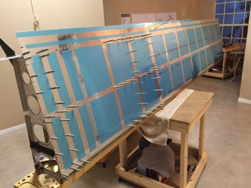 More riveting on L wing top skin