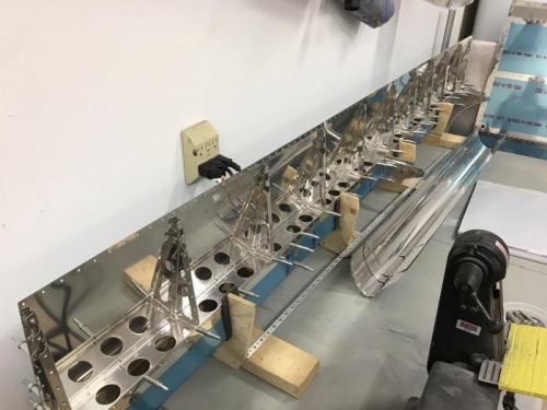 riveting of L flap and deburring, etc. of R flap