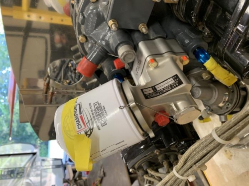 Oil filter adapter with spacer to allow for stby alternator