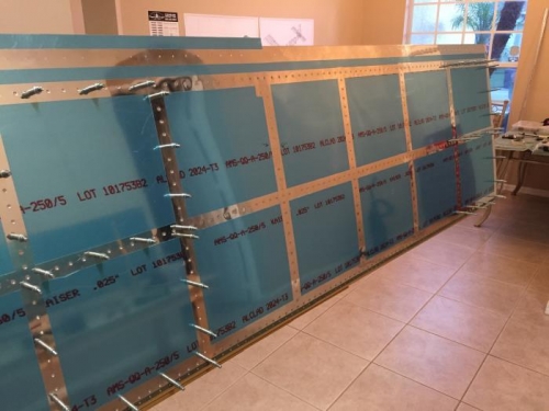 Began riveting on L top wing skin