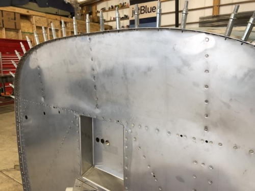 Top ribs riveted to firewall