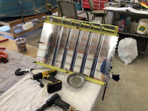 Rear seat backs primed and deburred, etc.