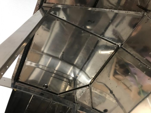 Door and hinge riveted on