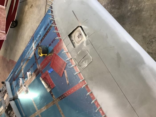 Fabricating door for tip tank fuel cap access