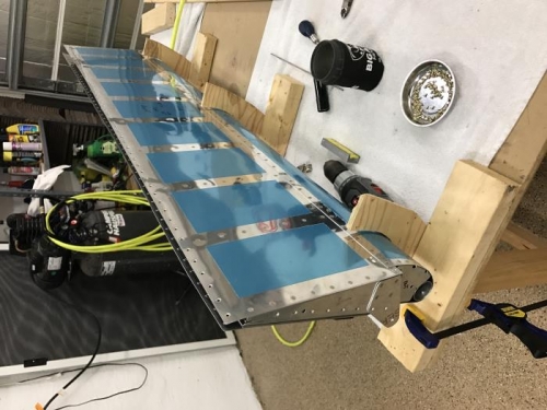 R aileron being riveted to spar and nose ribs