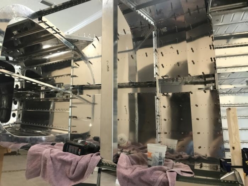 interior skins shown drilled out and removed for deburring and dimpling