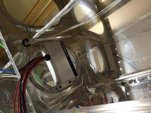 Just outboard of pitot tube accessible through an access hole