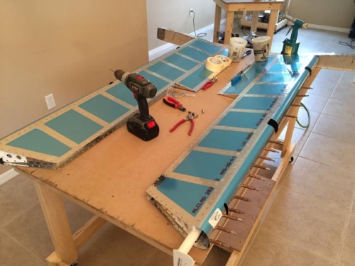 Trailing edge riveted, leading edges rolled working on trim tab