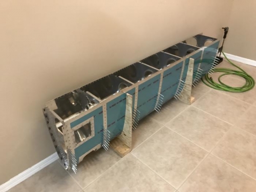 Began riveting R wing outboard leading edge