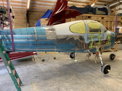 Leveling plane in prep for wheel pants alignment.  More Fiberglass work