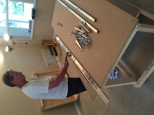 Deburring, dimpling and prepping elevators for  their assembly