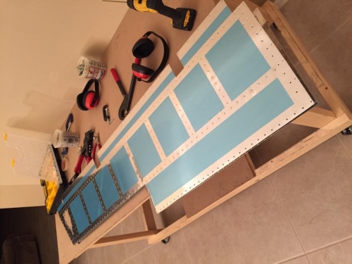 Riveting together both elevators