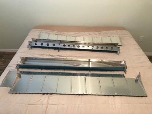 Ailerons disassembled, deburred, dimpled, countersunk, and ready for rivetingt