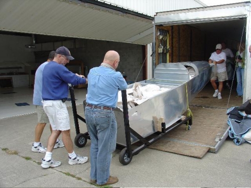 Doc, Bruce Williams, me and a host of others unload the first kit - mine.