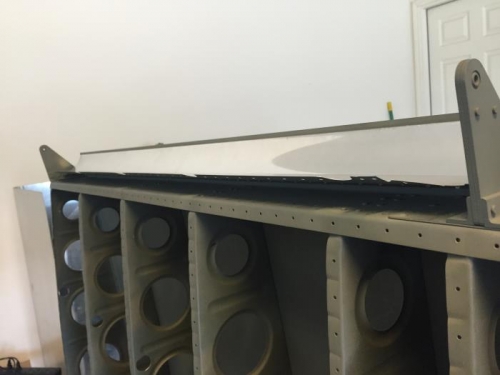 Got Justin to help buck the internal rivets to the upper wing skin