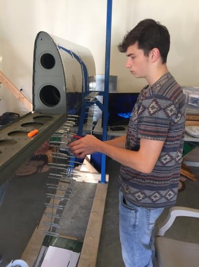 My Son helping buck some rivets