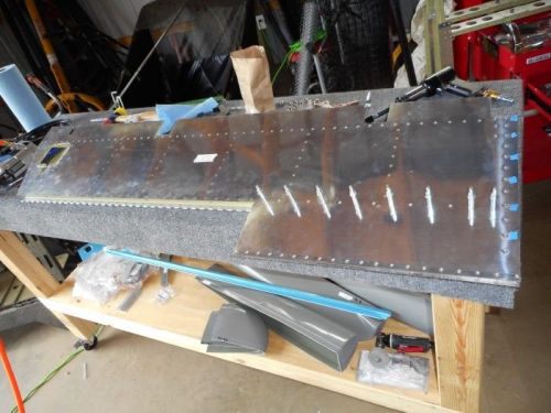 Riveting rear spars to skins