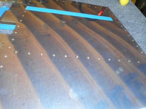 Taping rivets for back riveting