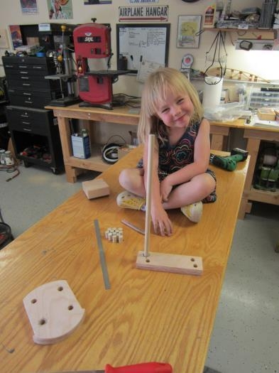 Marking dowel lengths for Daddy to cut.