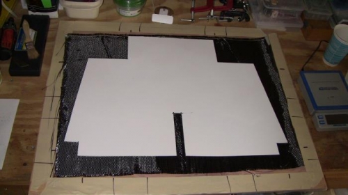 Carbon Fiber laid out and cardboard template ready.