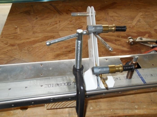 Drilling the seatbelt anchors