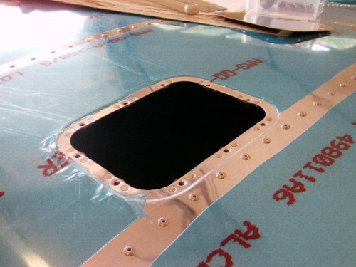 Nutplates Riveted to Hatch Opening