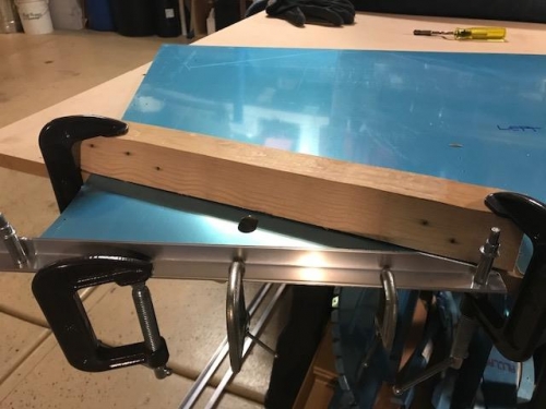 Wood brake bar and two angle pieces attached