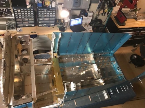 Mid skin and floor assembly