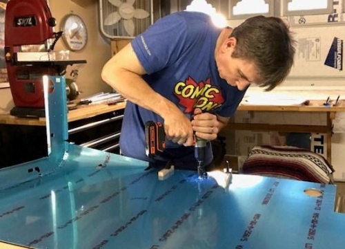 Fly cutter cutting hole in right mid skin