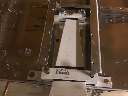 Drilled and bolted outer wear plate for both left and right gear mounts