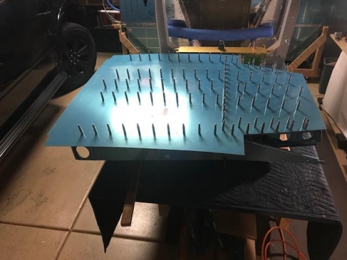 Radiused floor skin clecoed to the floor assembly